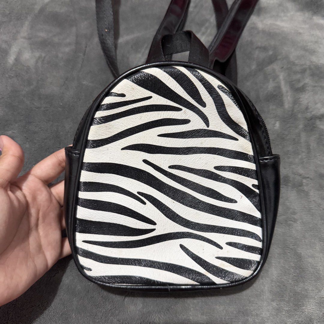 Wild Fable Zebra Print Faux Leather Mini Backpack (Category: Backpacks) located in Mandaluyong City. Submitted by josa_xox0i8 (Listing ID 1470518409, Image 1). Description: Selling a super cute pre-loved Wild Fable (Target US brand) mini dome backpack in zebra print! Perfect for daily casual carry, festival vibes, or street style outfits. 🦓🖤 🇺🇸 Original US Price: ~$15–$20 MSRP ✨ Product Details: • Brand: Wild Fable (100% Authentic US Bought) 