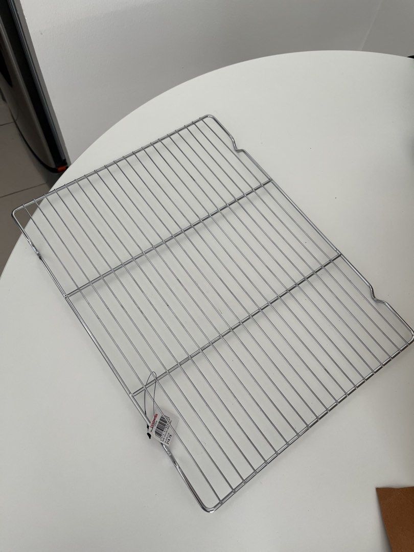 Wire Cooling Rack Small 39.5x30.5cm (Category: Bakeware) located in Manila. Submitted by matildawormwood26 (Listing ID 1470381506, Image 1). Description: - Brand: Landmark - Item: Small wire cooling rack - Dimensions: 39.5 x 30.5 cm - Material: Durable stainless steel grid design - Condition: Brand new, never used, original store tag still attached - Ideal for: Cooling freshly baked breads, cookies, and pastries, Dishwashing RFS: wrong size, did 
