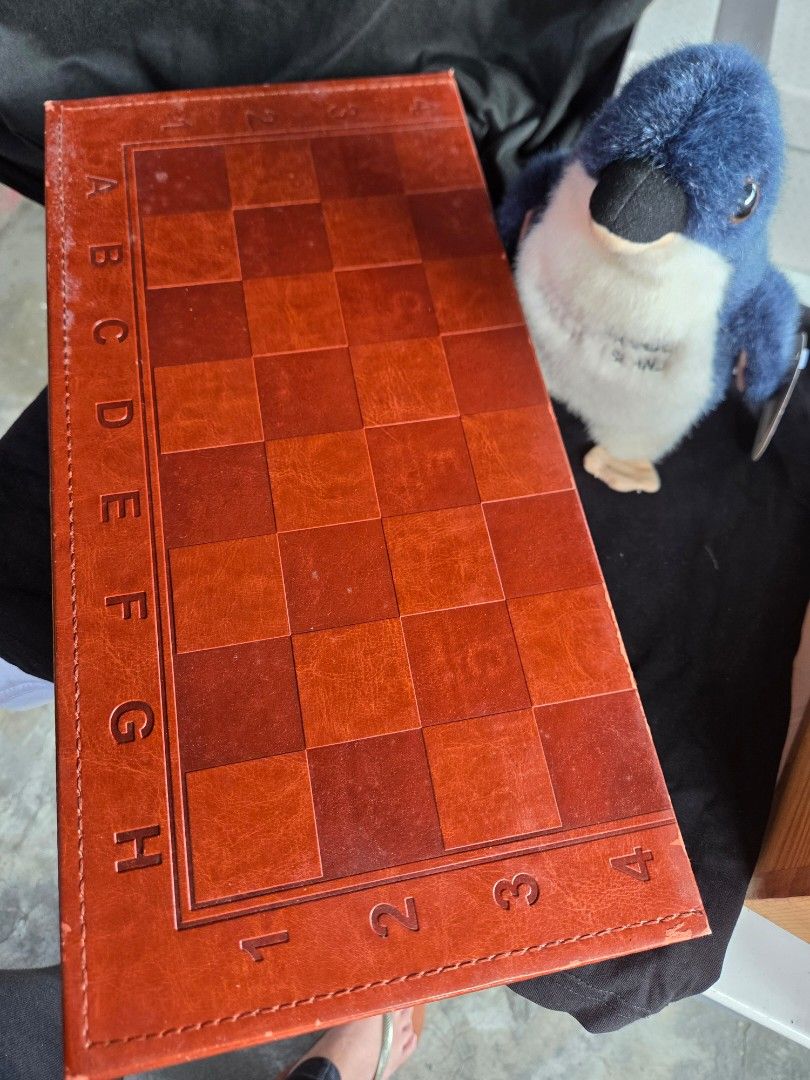 Wooden Foldable Chess and Backgammon Board Game Set (Category: Board Games & Puzzles) located in Consolacion. Submitted by itsybitsywins (Listing ID 1470449185, Image 2). Description: - 2-in-1 Board Game: Includes both chess and backgammon in one portable set. - Premium Design: Wooden folding board with a sleek leather-style finish. - Complete Set: Comes with all standard chess and backgammon playing pieces. - Travel-Friendly: Board folds in half