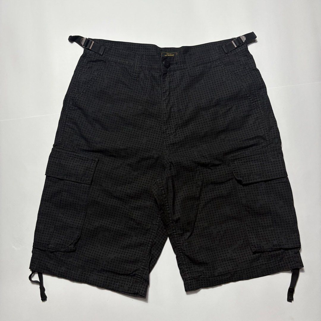 Xlarge Black Cargo Shorts Size 32 (Category: Shorts) located in San Fernando. Submitted by lumang_gamit (Listing ID 1470398337, Image 1). Description: - Size: 32 waist (Xlarge fit) - Color/Pattern: Black grid pattern - Fit & Adjustability: Side adjustment buckles at the waistband and drawstring leg openings - Storage: Multiple utility pockets with secure button flaps - Details: Features woven brand labels on the inside and back pocket.
