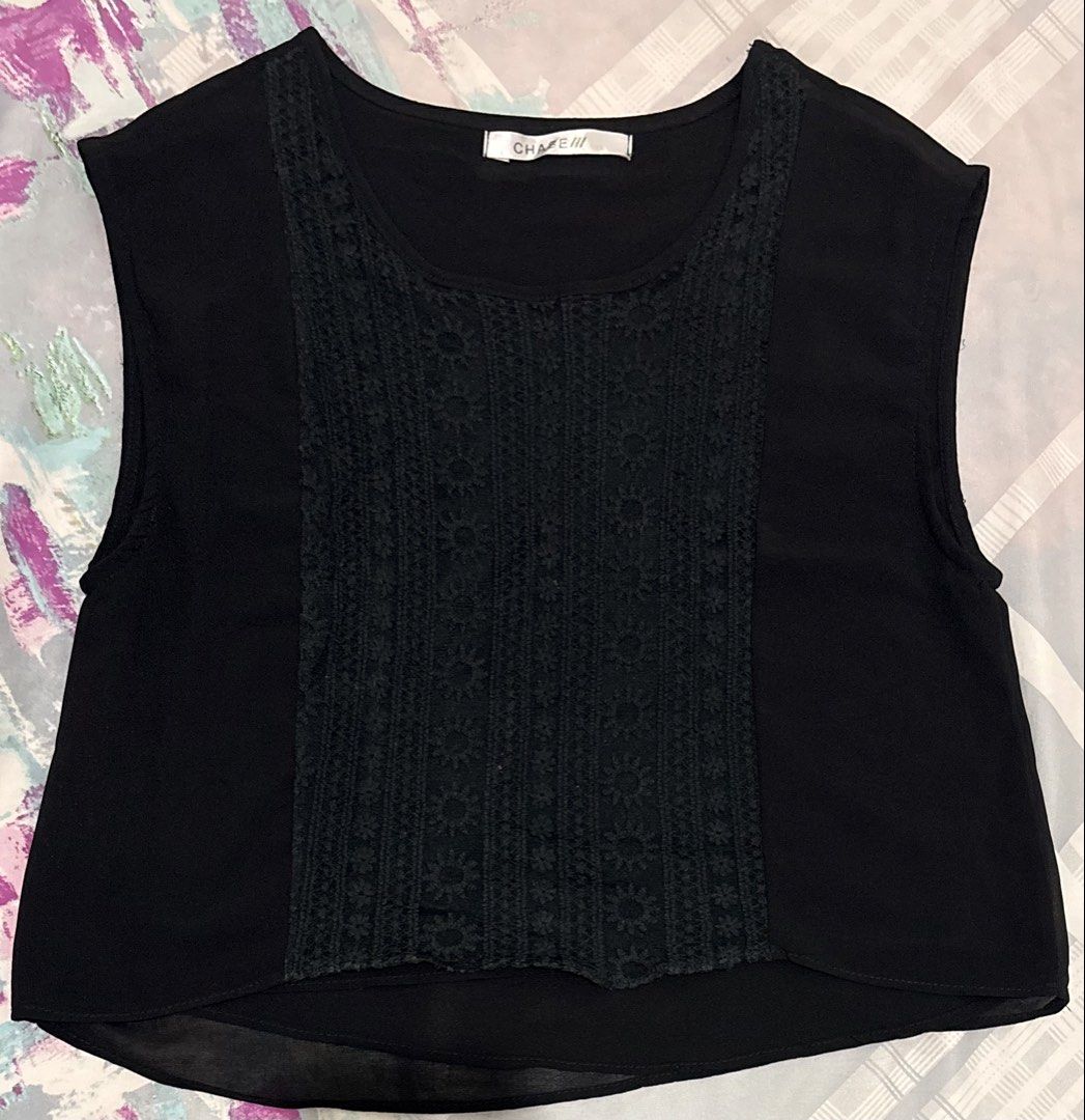 Y2K Black Lace Panel Sleeveless Blouse (Category: Sleeveless) located in Manila. Submitted by areiei (Listing ID 1470366300, Image 2). Description: - Brand: Chase - Size: S-M - Style: Black sleeveless blouse with scoop neckline - Details: Beautiful front center panel with floral embroidered lace - Fabric: Lightweight and breathable, with a stylish slightly sheer hemline - Fit: Solid black fabric on the sides and back for a flattering silhouette.