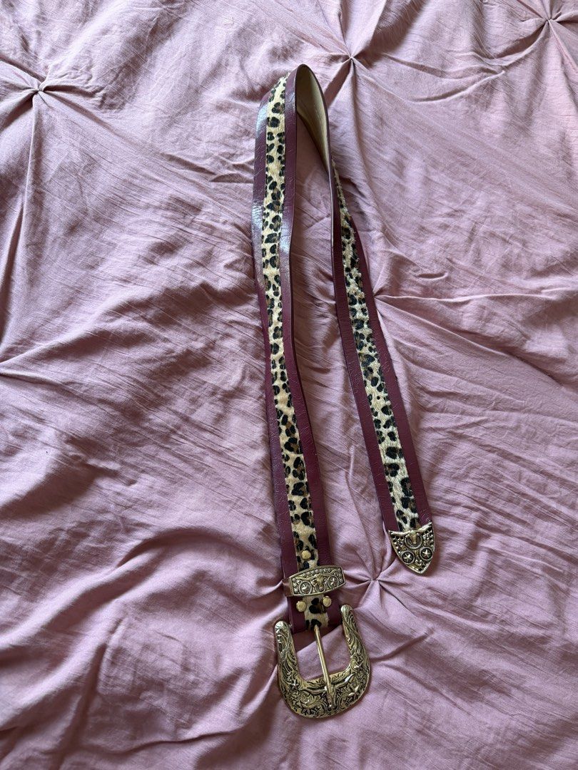 y2k leopard print burgundy belt (Category: Belts) located in Manila. Submitted by _____car0usell (Listing ID 1470392834, Image 3). Description: - used only once - rich burgundy color with a trendy leopard print calf hair center panel - hardware: Ornate gold-tone western-style buckle, keeper loop, and tip - multiple holes for easily adjustable sizing - no issues.