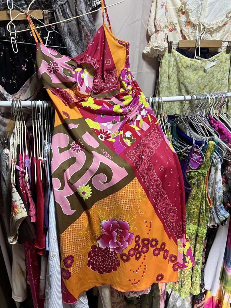Y2K Patchwork Floral Halter Dress Multi-color (Category: Dresses) located in Manila. Submitted by threadly (Listing ID 1470400427, Image 1). Description: - Vibrant patchwork design with mixed floral and paisley prints - Eye-catching color palette of bright orange, pink, magenta, and olive green - Unique keyhole cutout at the neckline with gathered straps - Lightweight, flowy, and breathable fabric - Sleeveless with adjustable spaghetti straps - F