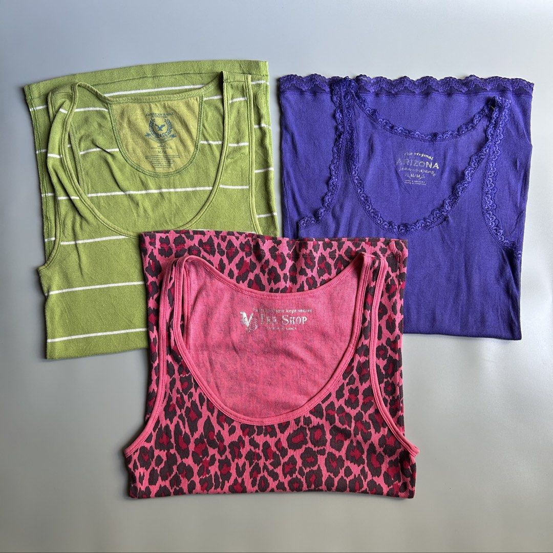 y2k tanktops- VS/Arizona/American Eagle| aspack (Category: Others Tops) located in Liloan. Submitted by fairymary.ph (Listing ID 1470458874, Image 2). Description: READ BIO BEFORE BUYING✨ take 3 tanktops for layering P200+sf (no more haggling please) all sizes are MEDIUM on tag brands: victoria’s secret- leopard print pink (no issue) american eagle- green with logo (no issue) arizona- violet lace (with tear).