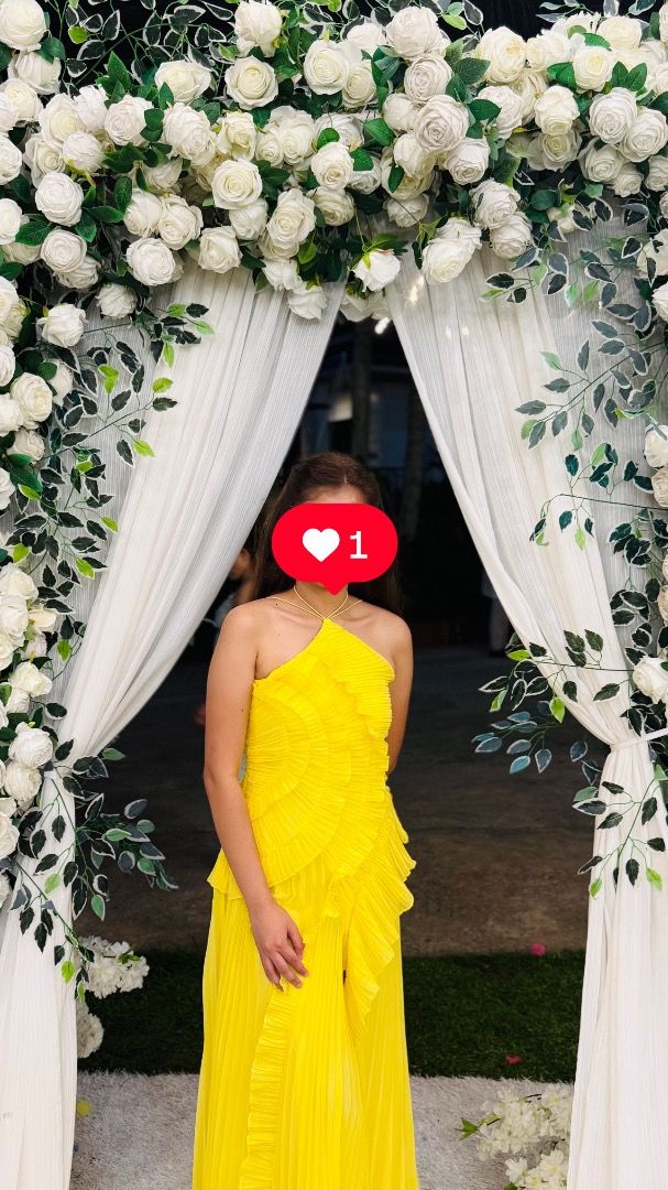 Yellow Bridesmaid/MOH Dress (Category: Dresses) located in Cavite. Submitted by keendragon_84649a (Listing ID 1470492925, Image 2). Description: - Color: Bright vibrant yellow (super photogenic) - Style: Halter neck with thin straps, fitted bodice, long maxi length - Details: All-over pleated fabric with stylish diagonal ruffle tiers in front - Condition: Worn once during my friends wedding, freshly dry cleaned and ready to wear - Perfect for: Pa