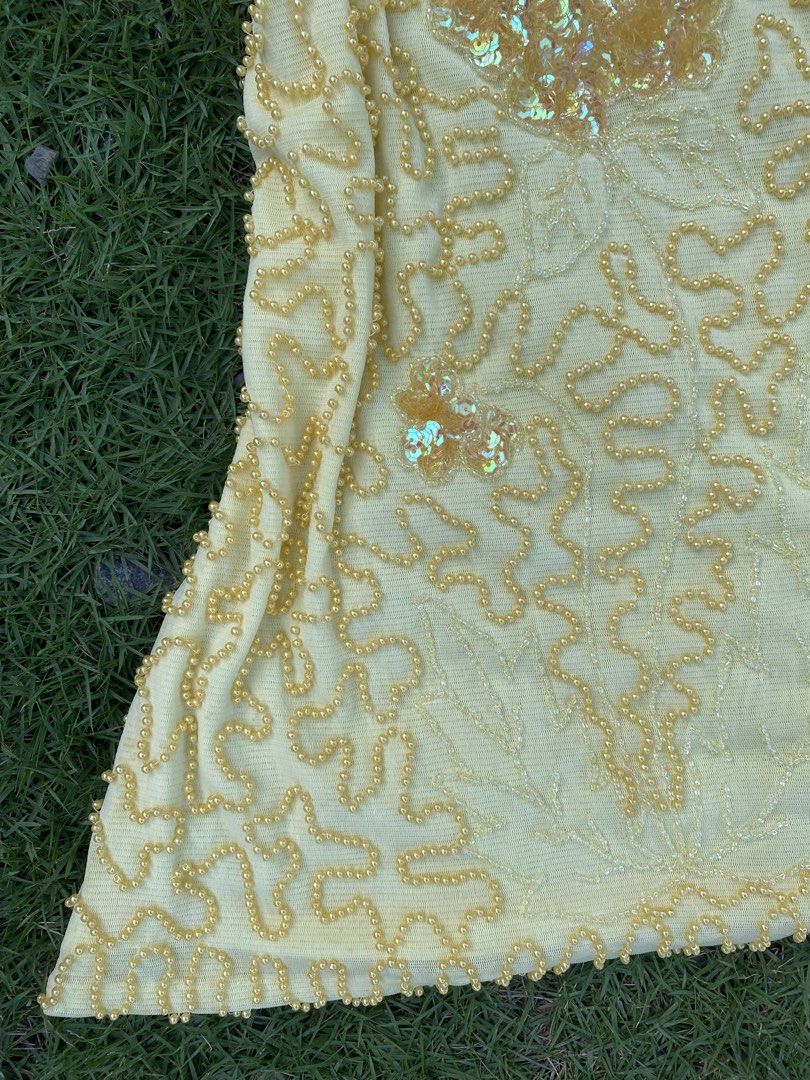 Yilisha Yellow Beaded Sequin V-Neck Top (Category: Blouses) located in Roxas City. Submitted by dua-garments23 (Listing ID 1470445157, Image 3). Description: - Condition: Brand new with original store tags - Color: Bright yellow - Material: Mesh fabric with intricate beadwork and sequins - Design: Front floral sequin applique, V-neckline, and cap sleeves - Fit: Fitted silhouette.