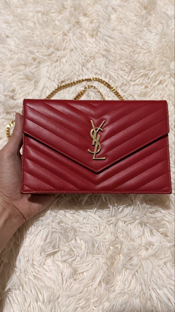 YSL Cassandre Envelope Chain Wallet (Category: Luxury Bags & Wallets) located in Pasay City. Submitted by erinsclosetph (Listing ID 1470508211, Image 2). Description: Excellent preloved condition in a classic red finish with gold-tone hardware. No issues noted. Perfect for date nights and events. Inclusions: Card and dust bag More pictures available upon request..