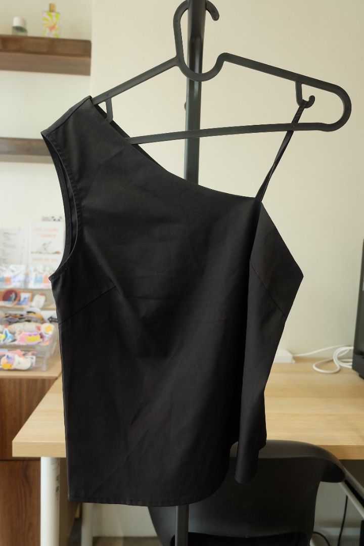 Zalora Work Black One-Shoulder Top Size S (Category: Sleeveless) located in Quezon City. Submitted by thriftcloset_xo (Listing ID 1470403121, Image 2). Description: - Brand: Zalora Work - Color: Classic Black - Size: S - Design: Asymmetrical one-shoulder with a thin strap - Fit: Structured fit through the body - Versatility: Ideal for office wear or going out - Condition: Pre-loved, well-maintained.