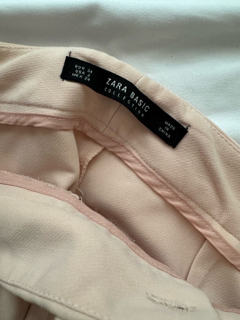 Zara Basic Collection Peach Pink Trousers Pants EUR 34 (Category: Jeans) located in Cebu City. Submitted by _t.rix (Listing ID 1470375773, Image 2). Description: - Brand: Zara Basic Collection - Size: EUR 34 / US 2 / MEX 24 (Fits true to size) - Color: Peach pink - Style: Tailored with clean waistband and back welt pockets - Fabric: Smooth finish - Versatility: Perfect for work or casual days.
