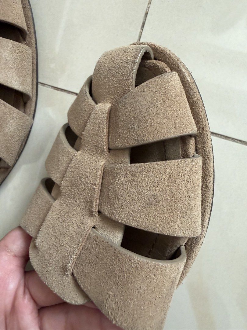ZARA Beige Suede Flat Sandals Size 37 (Category: Flats & Sandals) located in Makati City. Submitted by andzr. (Listing ID 1470425584, Image 2). Description: ZARA beige suede sandals in size 37. Flat style with woven strap design across the top. Adjustable ankle strap with gold-tone buckle. Soles show light signs of wear from walking. Soft material, comfortable fit for daily outfit pairings..