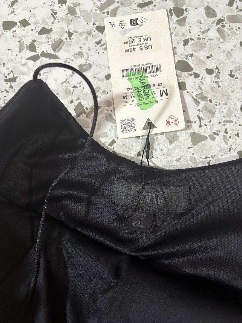 Zara Black Corset Style Top Size M (Category: Sleeveless) located in Mandaluyong City. Submitted by theameii (Listing ID 1470415975, Image 3). Description: - Brand: Zara - Condition: Brand new with original tags (never worn) - Size: M - Color: Classic Black - Design: Structured bodice, flared hem, and delicate spaghetti straps - Closure: Easy side zipper - Origin: Made in Morocco - Clean and smoke-free home.