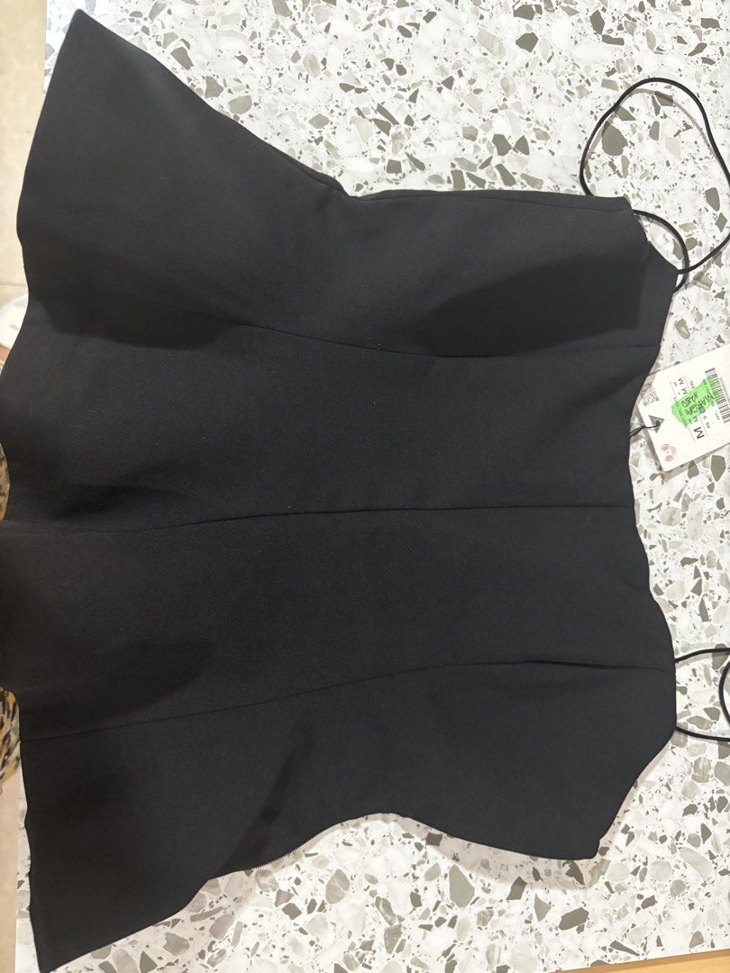 Zara Black Corset Style Top Size M (Category: Sleeveless) located in Mandaluyong City. Submitted by theameii (Listing ID 1470415975, Image 1). Description: - Brand: Zara - Condition: Brand new with original tags (never worn) - Size: M - Color: Classic Black - Design: Structured bodice, flared hem, and delicate spaghetti straps - Closure: Easy side zipper - Origin: Made in Morocco - Clean and smoke-free home.