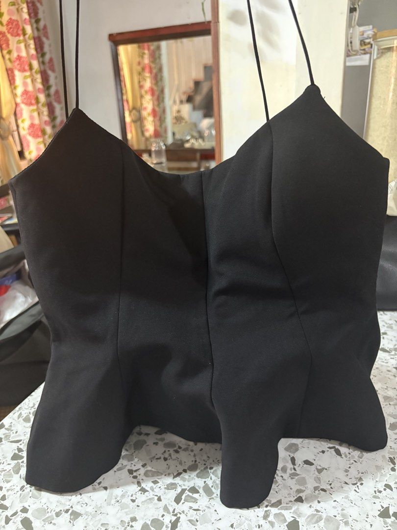 Zara Black Corset Style Top Size M (Category: Sleeveless) located in Mandaluyong City. Submitted by theameii (Listing ID 1470415975, Image 2). Description: - Brand: Zara - Condition: Brand new with original tags (never worn) - Size: M - Color: Classic Black - Design: Structured bodice, flared hem, and delicate spaghetti straps - Closure: Easy side zipper - Origin: Made in Morocco - Clean and smoke-free home.