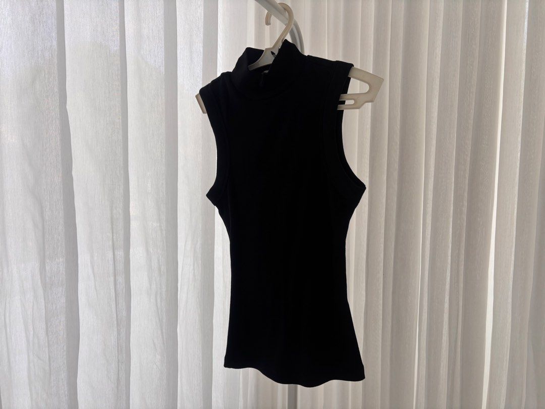 ZARA black sleeveless mock neck top (Category: Sleeveless) located in Manila. Submitted by gothclaudia (Listing ID 1470429555, Image 1). Description: - black sleeveless top with mock neck - size S - very stretchy and comfortable - versatile, classic basic that pairs with any outfit tbh - slimming to the figure!!!.