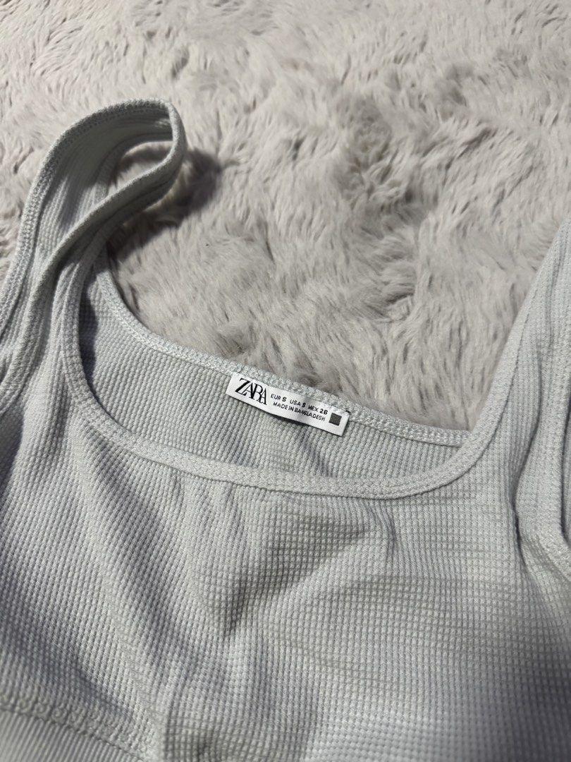 Zara Grey Ribbed Crop Top Size S (Category: Sleeveless) located in Calamba. Submitted by cheriiv (Listing ID 1470513770, Image 2). Description: Washed, never worn. Not padded. - Brand: Zara - Item: Ribbed crop top - Color: Light grey - Size: S (EUR/USA/MEX) - Details: Square neckline, wide straps, supportive thick underband - Material: Stretchy knit fabric.