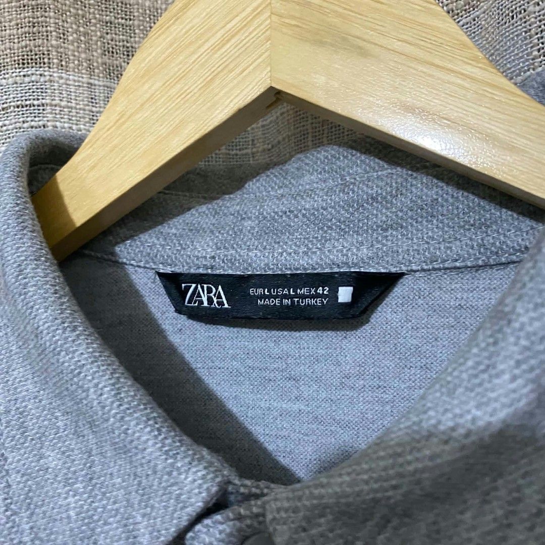 Zara Heather Grey Men's Comfort Overshirt (Category: Coats, Jackets and Outerwear) located in Cainta. Submitted by kapatidnibrother (Listing ID 1470540063, Image 2). Description: Zara Heather Grey Men's Comfort Overshirt Size Large on tag Dimes: W23 | L28 Color rate: 9.5/10 - heavy x thick fabric - pristine condition - complete tags - need wash - fav!.