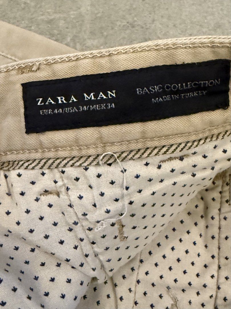 Zara Man Chinos Khaki Size 34 (Category: Chinos) located in Muntinlupa City. Submitted by el1b12345 (Listing ID 1470377630, Image 2). Description: - Brand: Zara Man (Basic Collection) - Color: Khaki Beige - Size: EUR 44 / USA 34 / MEX 34 - L - 39" - Origin: Made in Turkey - Fit: Classic slim straight cut with belt loops and button closure - Details: Stylish polka dot inner lining and two back welt pockets with button accents - Condition: Normal w