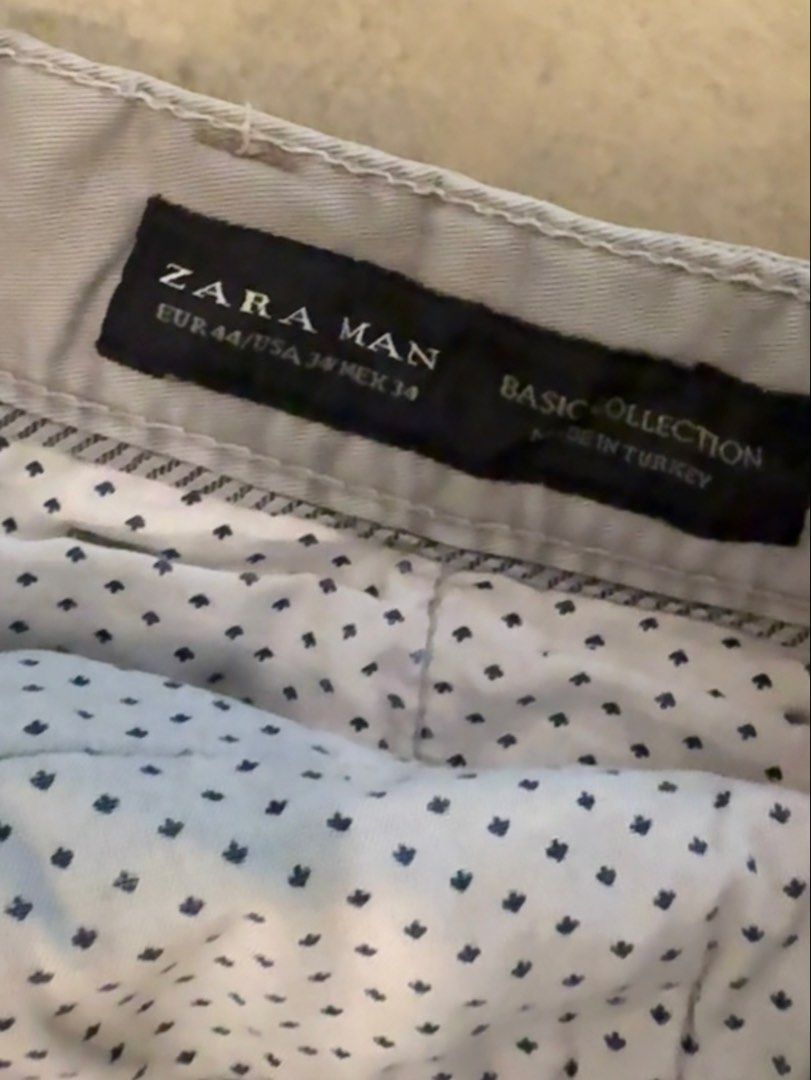 Zara Man Grey Chinos Size 34 (Category: Chinos) located in Muntinlupa City. Submitted by el1b12345 (Listing ID 1470377715, Image 3). Description: - Brand: Zara Man (Basic Collection) - Color: Versatile grey (neutral tone) - Size: EUR 44 / US 34 / MEX 34 - L - 37" - Fit: Regular fit chinos - Material: Solid cotton, made in Turkey - Features: Button and zip fly, 2 front pockets, 2 buttoned back pockets - Condition: Great for casual and smart-casual
