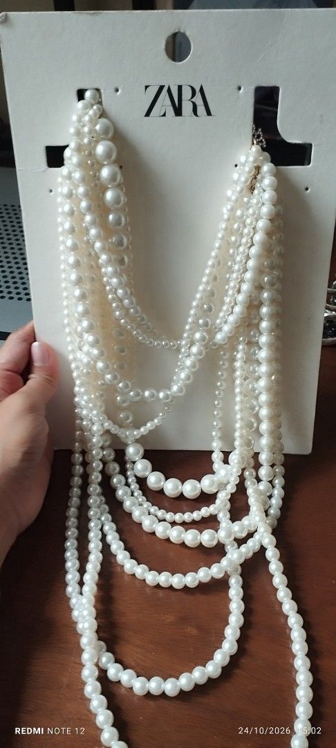 Zara Pearl Multi-strand Necklace (Category: Necklaces) located in Makati City. Submitted by larasdowry (Listing ID 1470553625, Image 1). Description: take all accessories. pearl necklace used once. Zara chord pearl necklace new. vintage clip earrings very nice. tried only. cultured pearl bracelet used. all for 1200.
