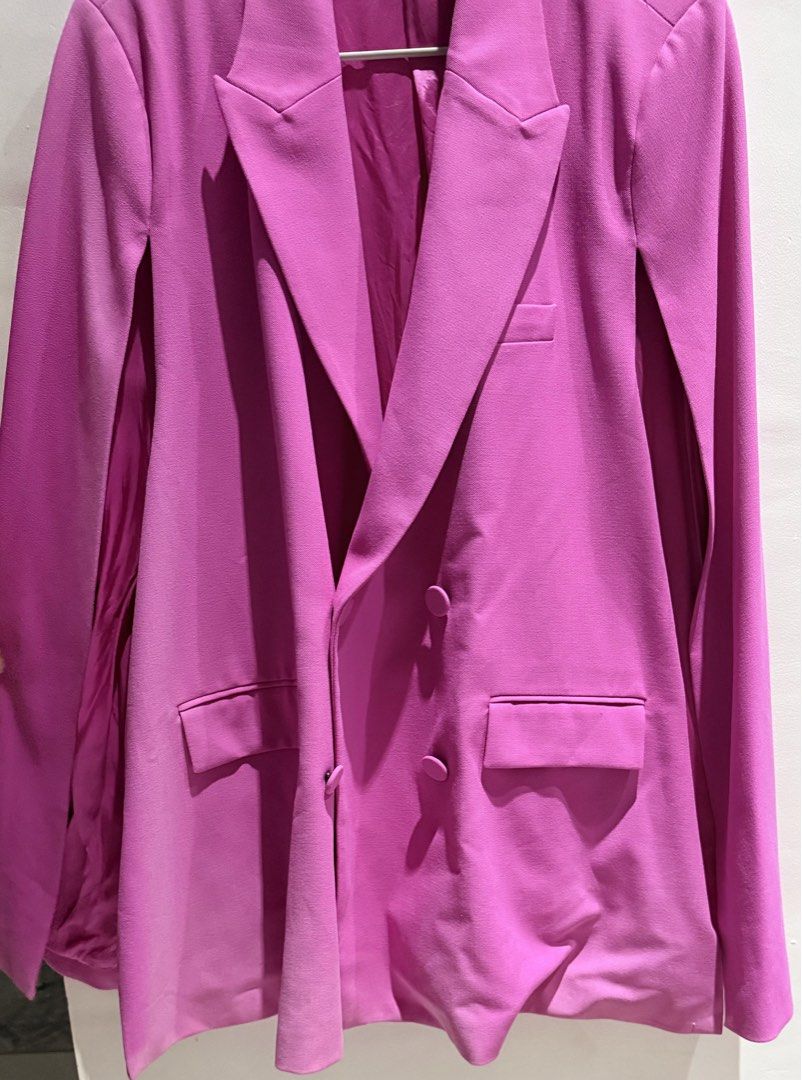 Zara Pink Cape Blazer Jacket Size XL (Category: Coats, Jackets and Outerwear) located in Manila. Submitted by beautymasters (Listing ID 1470494608, Image 2). Description: - Brand: Zara -Size: XL - Style: Double-breasted cape blazer with trendy slit sleeves - Color: Vibrant bright pink - Features: Structured lapels, front flap pockets, fully lined interior - Origin: Made in Morocco - Condition: Clean, modern statement piece.
