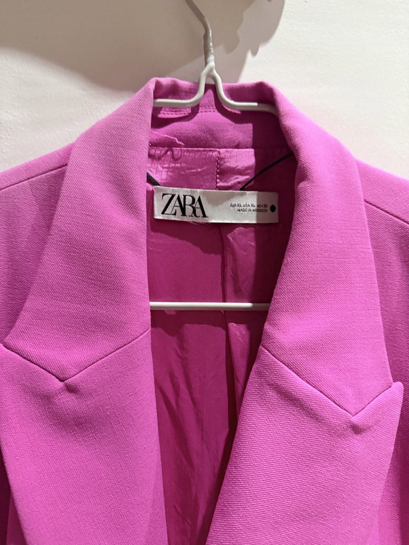 Zara Pink Cape Blazer Jacket Size XL (Category: Coats, Jackets and Outerwear) located in Manila. Submitted by beautymasters (Listing ID 1470494608, Image 3). Description: - Brand: Zara -Size: XL - Style: Double-breasted cape blazer with trendy slit sleeves - Color: Vibrant bright pink - Features: Structured lapels, front flap pockets, fully lined interior - Origin: Made in Morocco - Condition: Clean, modern statement piece.