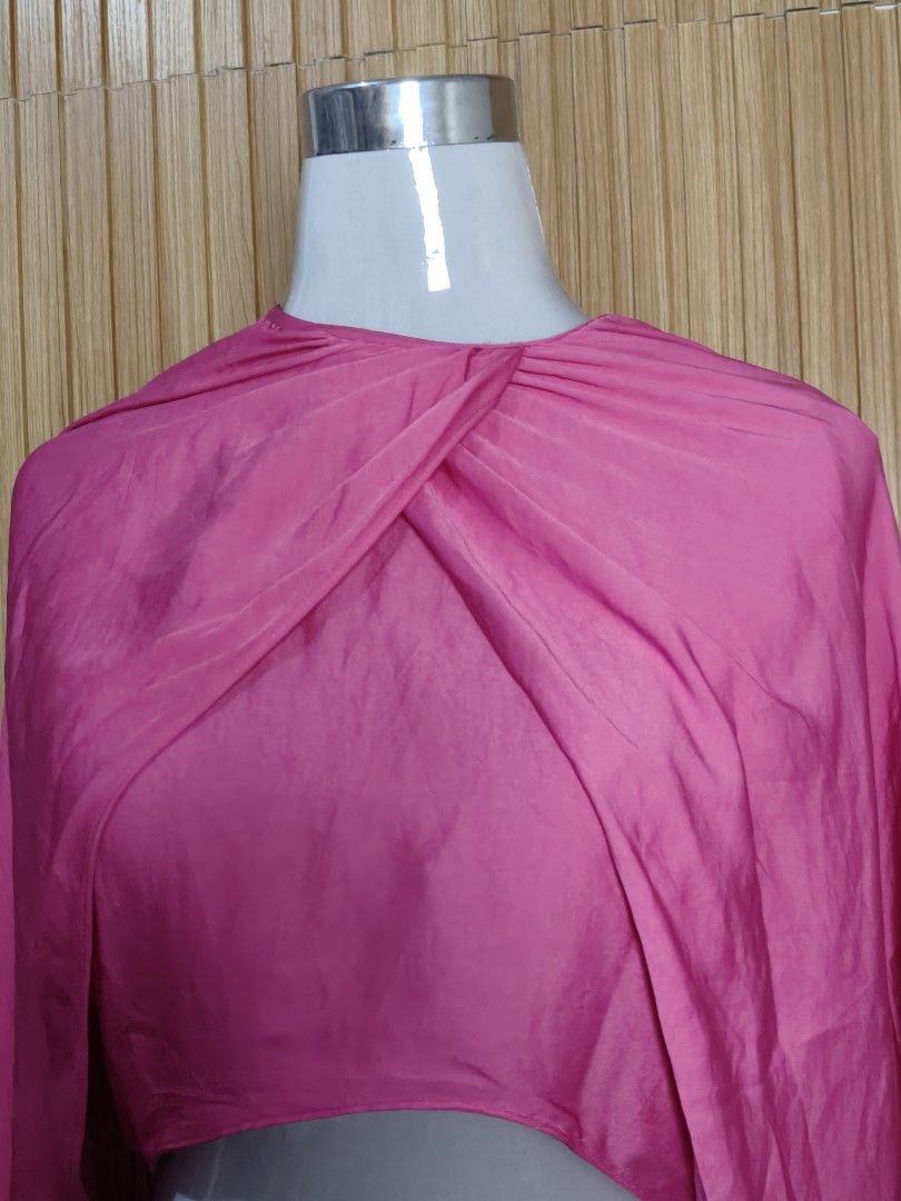 Zara Pink Cropped Blouse Top Size L (Category: Blouses) located in Taguig. Submitted by ashie_clothing (Listing ID 1470380137, Image 3). Description: - Brand: Zara - Size: Large (L) - Condition: Brand New with Tags (BNWT) - Color: Vibrant Pink - Details: Draped twisted front, long balloon sleeves with banded cuffs - Origin: Made in Turkey - Perfect for: Parties, casual outings, and statement looks.