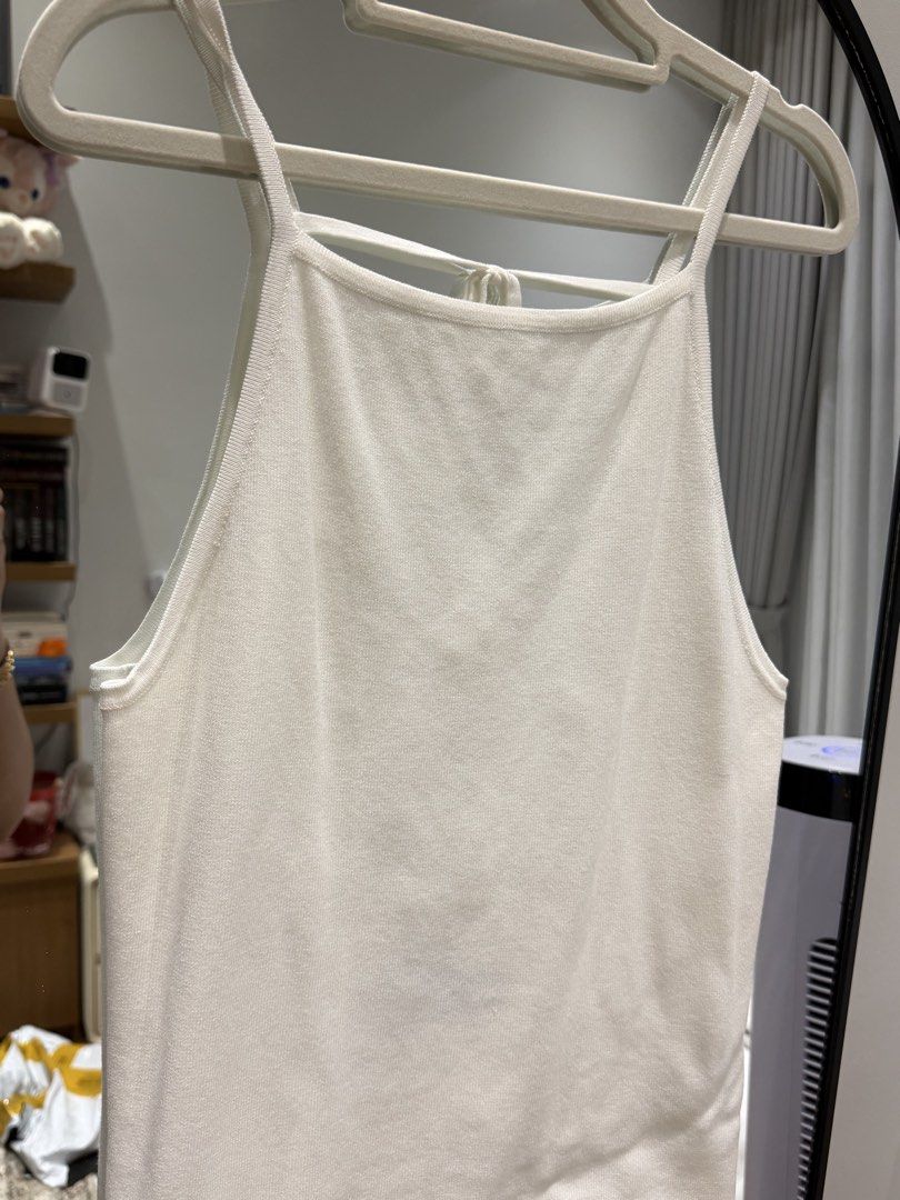 ZARA White halter tank top with back straps (Category: Sleeveless) located in Meycauayan. Submitted by m4teri4lgirl (Listing ID 1470509865, Image 1). Description: - Color: White - Style: Halter top with open back and criss-cross ties - Fabric: Soft and stretchy ribbed knit - Neckline: Classic square front - Versatility: Easy to style with high-waist jeans, shorts, or skirts - Condition: Brand new / Excellent quality.