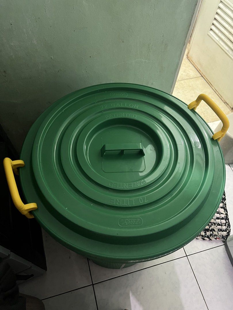 Water Container / Zooey 70 L Green Storage Bin (Category: Storage Boxes & Baskets) located in Manila. Submitted by eddiebenta26 (Listing ID 1470412767, Image 3). Description: - Brand: Zooey - Capacity: 70 Liters / 22 Gallons - Color: Green body with bright yellow side handles - Includes matching lid with central handle - Durable ribbed body and sturdy construction - Ideal for home, garage, or outdoor organization - Condition: Brand new / Excellen