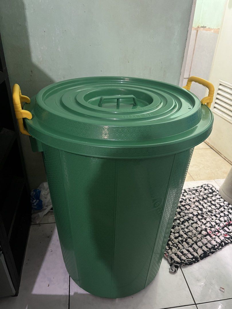 Water Container / Zooey 70 L Green Storage Bin (Category: Storage Boxes & Baskets) located in Manila. Submitted by eddiebenta26 (Listing ID 1470412767, Image 1). Description: - Brand: Zooey - Capacity: 70 Liters / 22 Gallons - Color: Green body with bright yellow side handles - Includes matching lid with central handle - Durable ribbed body and sturdy construction - Ideal for home, garage, or outdoor organization - Condition: Brand new / Excellen
