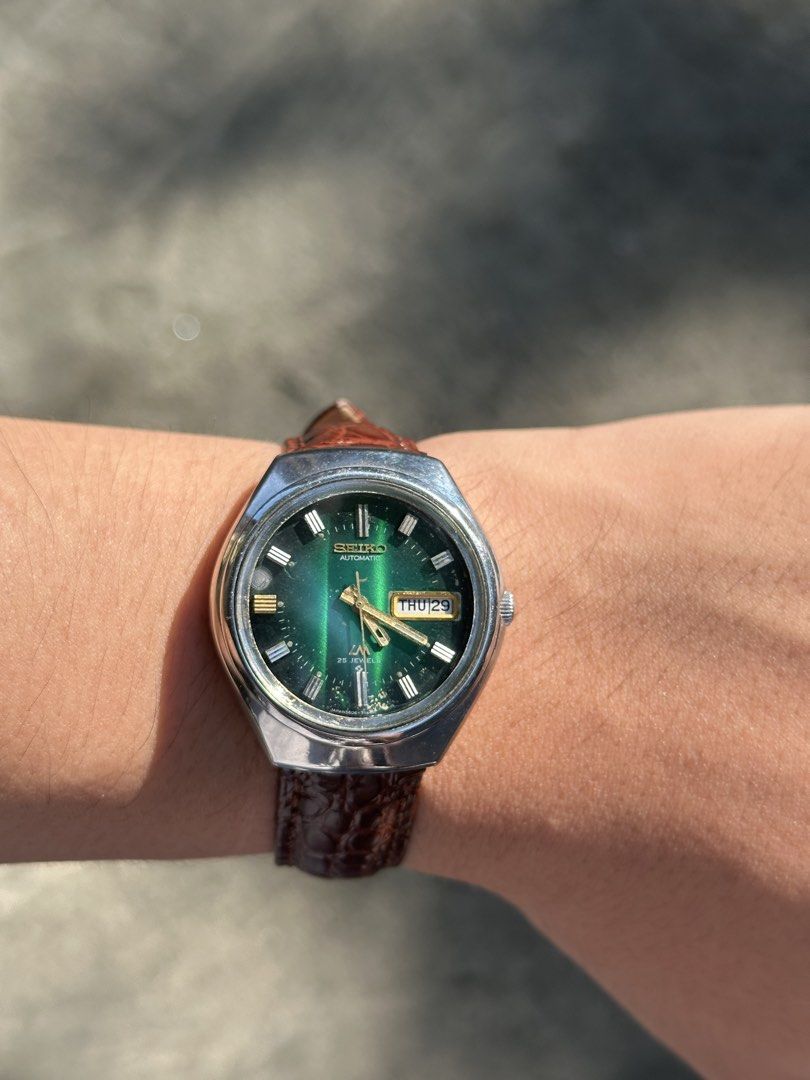 1973 Seiko Lordmatic Green Emerald Dial (Category: Men's Watches) located in Pasig City. Submitted by grand.seikolover (Listing ID 1470624321, Image 2). Description: Seiko Lord Matic 5606-2917 25 Jewels Automatic Emerald Green Sunburst Dial – Newly Serviced Price: ₱10,000 (Negotiable) Description: For sale: Vintage Seiko Lord Matic 5606-2917, featuring a striking emerald-green sunburst dial that changes character under different lighting conditio