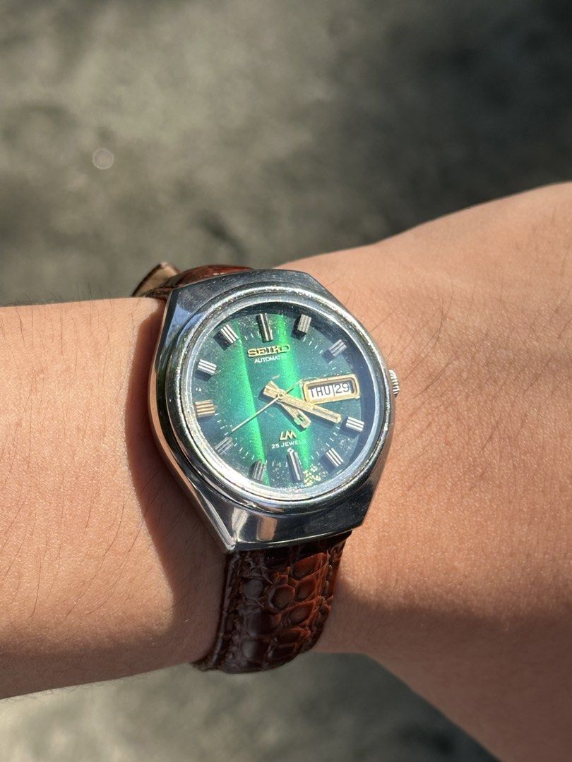 1973 Seiko Lordmatic Green Emerald Dial (Category: Men's Watches) located in Pasig City. Submitted by grand.seikolover (Listing ID 1470624321, Image 1). Description: Seiko Lord Matic 5606-2917 25 Jewels Automatic Emerald Green Sunburst Dial – Newly Serviced Price: ₱10,000 (Negotiable) Description: For sale: Vintage Seiko Lord Matic 5606-2917, featuring a striking emerald-green sunburst dial that changes character under different lighting conditio