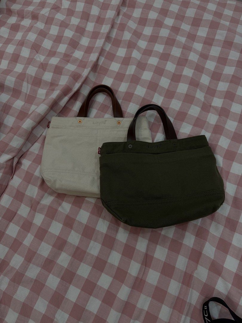 2 PCS Levi's Canvas Tote Bag Handbag (Category: Tote Bags) located in Tuguegarao City. Submitted by joysmithznjo (Listing ID 1470563030, Image 1). Description: - Authentic Levi's canvas tote bags available in Off-White or Dark Green - Features durable brown leather handles and a small front pocket with the classic Levi's red tab - Made from thick, sturdy canvas material built for daily use - Practical size that easily fits your daily essentials -