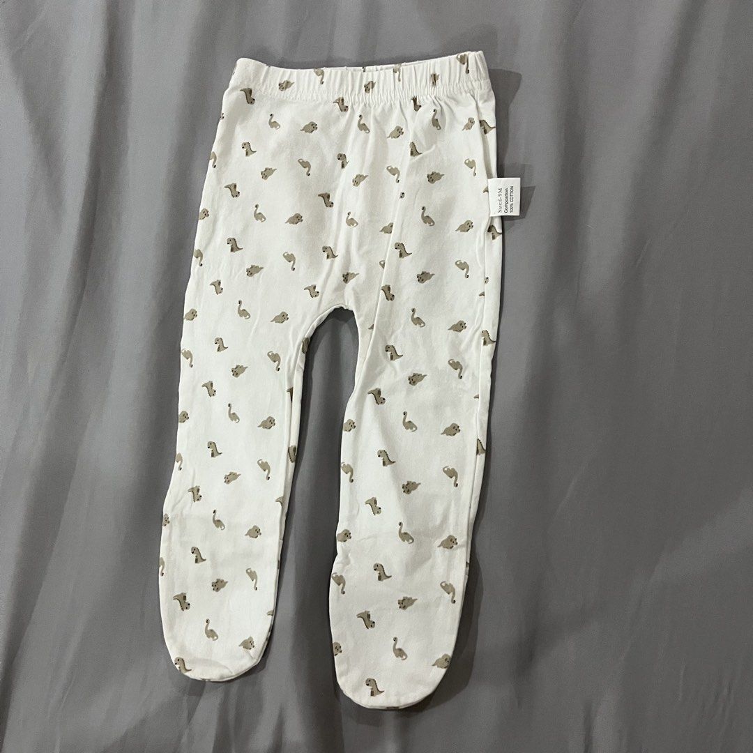 2 pcs. Baby Footed Pajama Pants (size 6-9m) (Category: Babies & Kids Fashion) located in Makati City. Submitted by happycloset5 (Listing ID 1470614404, Image 3). Description: - Size: 6-9 months - Set of 2 pairs: Light blue with navy blue stars, and off-white with grey dinosaur print.