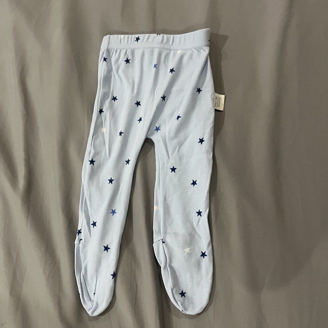 2 pcs. Baby Footed Pajama Pants (size 6-9m) (Category: Babies & Kids Fashion) located in Makati City. Submitted by happycloset5 (Listing ID 1470614404, Image 2). Description: - Size: 6-9 months - Set of 2 pairs: Light blue with navy blue stars, and off-white with grey dinosaur print.