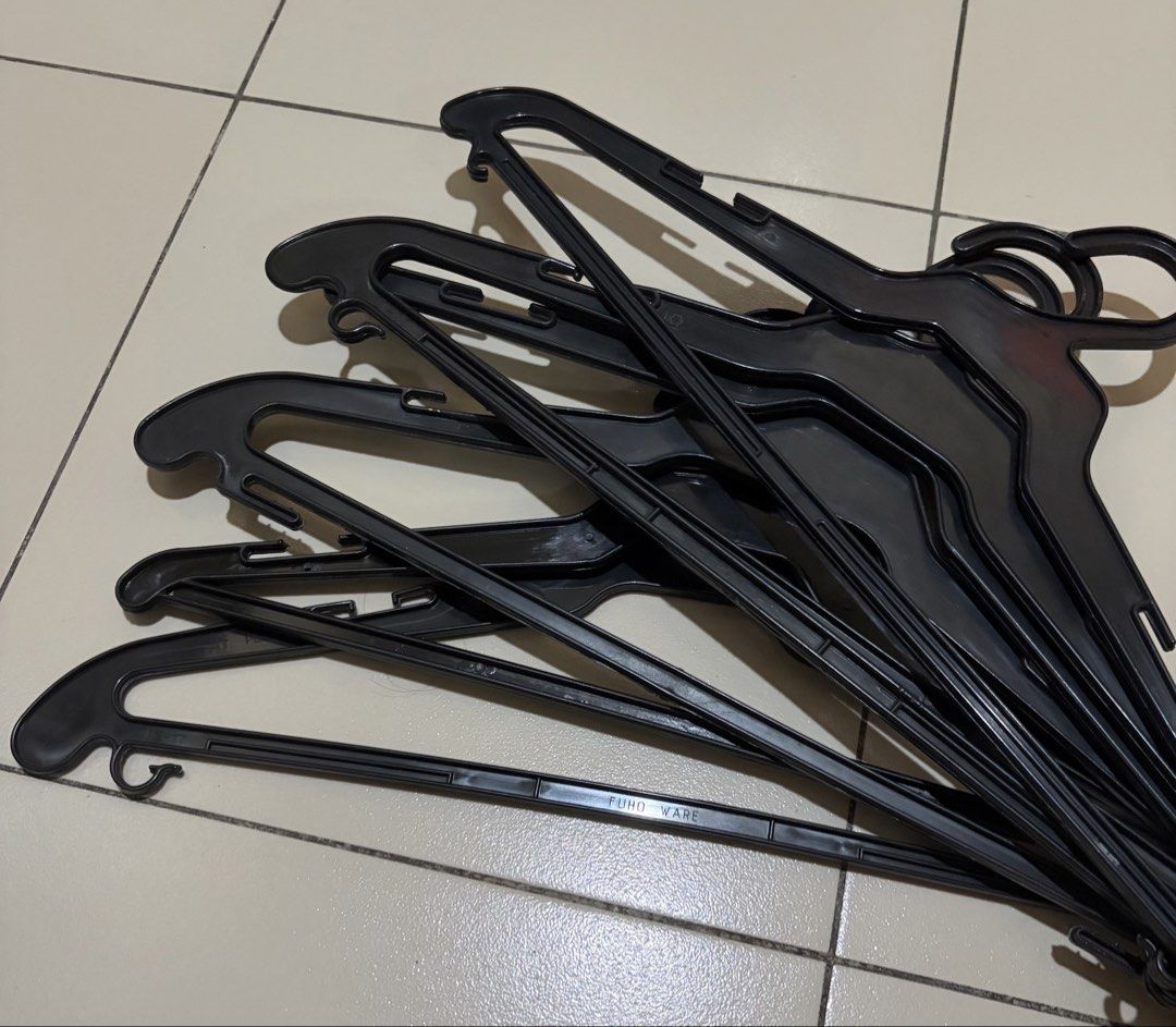 6 black plastic clothes hangers (Category: Hooks & Hangers) located in Muntinlupa City. Submitted by secondhandlove12345 (Listing ID 1470577550, Image 1). Description: - Color: Classic black - Material: Sturdy, durable plastic - Condition: Clean, excellent, no cracks or damage - Features: Shoulder notches and bottom bar hooks for straps and accessories - Size: Standard (ideal for shirts, pants, and daily wear) - Bundle: Sold as a whole set Pick u