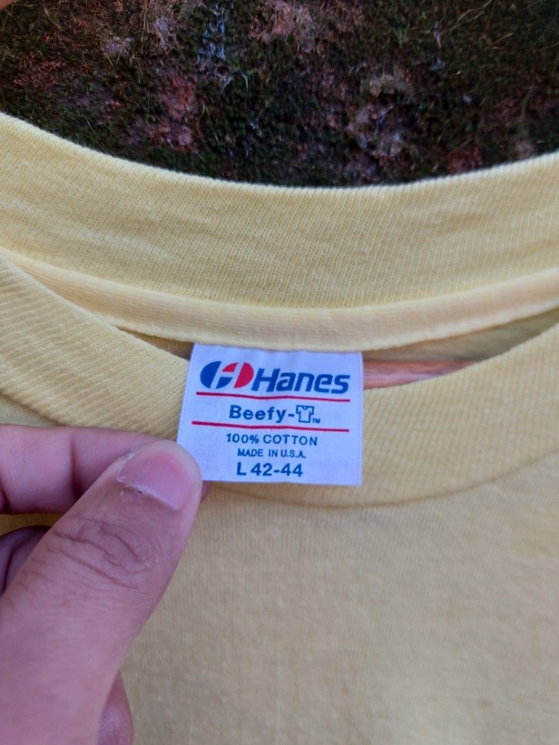 80's Promo Tee (Category: Tshirts & Polo Shirts ) located in Palayan City. Submitted by akhai420 (Listing ID 1470574640, Image 3). Description: - Brand/Style: Vintage 80's Hanes Beefy-T pocket tee - Design: D.C.B. Enterprises pinup graphics on front pocket and back - Material: Heavyweight 100% cotton, Made in U.S.A. - Era/Details: Classic single-stitch vintage tee - Size: L (42-44) - Condition: Good vintage feel, clean and vibrant color.