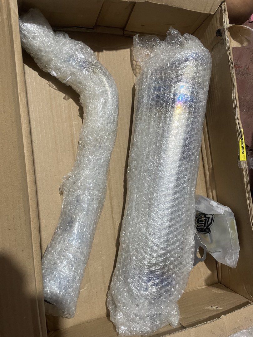 99 Racing Motorcycle Exhaust Pipe System (Category: Mufflers, Exhaust Parts & Accessories) located in Manila. Submitted by jyexclusivelux.ph (Listing ID 1470685368, Image 2). Description: 99 RACING PIPE BRANDNEW ONHAND FOR PCX 150 .