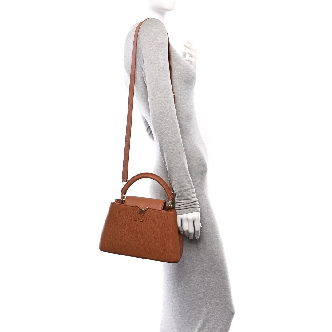 🖤 Louis Vuitton Taurillon Capucines BB Tan (Category: Luxury Accessories) located in Caloocan City. Submitted by mohsin2 (Listing ID 1470623106, Image 2). Description: Louis Vuitton Taurillon Capucines BB Tan 18,980p pkus sf Like new/Brandnew Colour Tan Taurillon leather Cowhide-leather trim Cowhide-leather lining Resin and gold-toned hardware Double-carry style: flap inside or outside Compartmented interior with 1 zipped pocket and 2 flat pocke