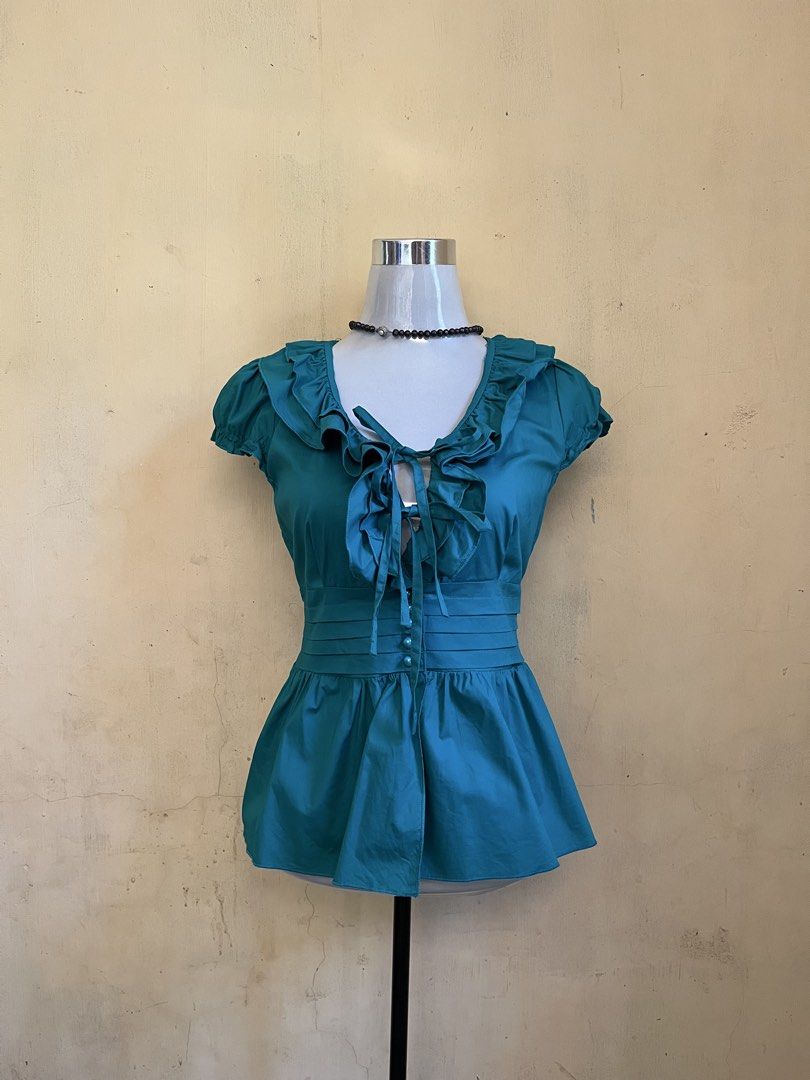 ✨ Y2K Teal Ruffled Tie-Front Peplum Blouse✨ (Category: Others Tops) located in Lupon. Submitted by weilclstle (Listing ID 1470656070, Image 1). Description: seller’s fav💗 Seller’s Reminder °~ payment first °~ manage your expectations as these clothes are thrifted °~ shipping fee will be shoulder by the buyer °~ issues will be stated if there’s any °~ wash before wearing ~ can request a video of the item ~ 🎀 Mode of Payment : Gcash ✮⋆˙ 🎀 Mode o