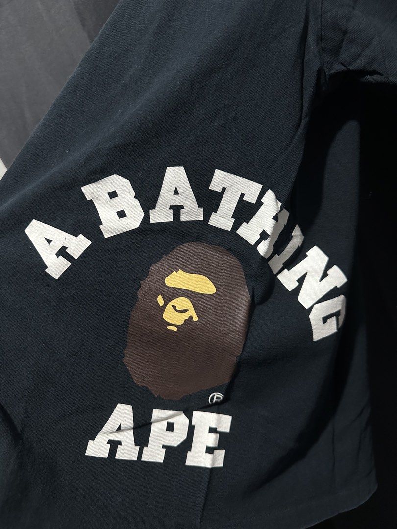 A Bathing Ape (BAPE) Asymmetric / Offset Ape Head Graphic Tee (Category: Tshirts & Polo Shirts ) located in Buenavista. Submitted by themodernrack (Listing ID 1470599476, Image 2). Description: Condition: Excellent Condition Measurements & Sizing: Size: Tagged Size S (BAPE regular fit; fits like Men’s S) Width (Pit to Pit): 19” Length: 25”.