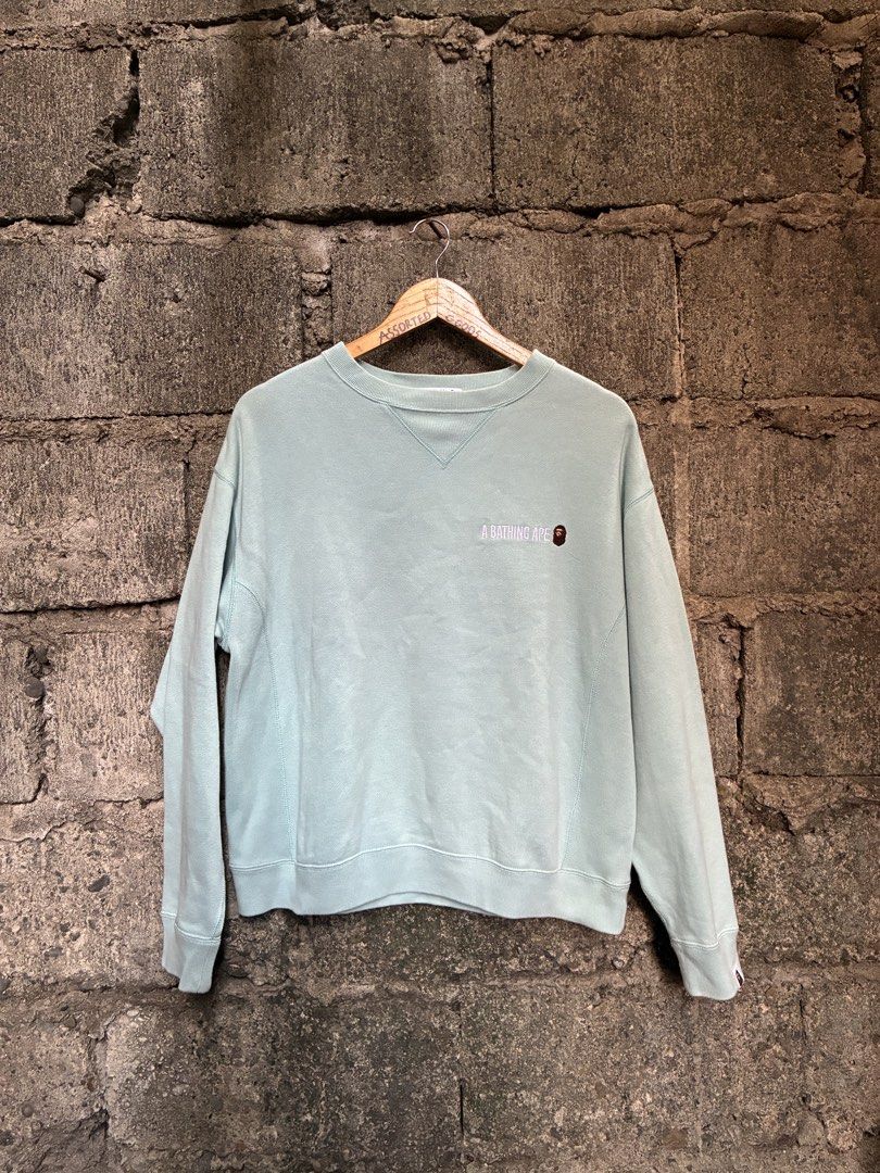 A Bathing Ape BAPE Mint Green Crewneck Sweatshirt (Category: Coats, Jackets and Outerwear) located in Manila. Submitted by assortedgoodsv3 (Listing ID 1470620209, Image 2). Description: - Authentic BAPE crewneck in mint green - Size: Small - Heavyweight cotton fleece material for a comfortable fit - Small embroidered logo on the chest - Large A Bathing Ape graphic hit printed on the back - Ribbed collar with a triangle insert - Classic ape head t