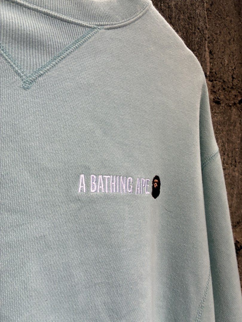 A Bathing Ape BAPE Mint Green Crewneck Sweatshirt (Category: Coats, Jackets and Outerwear) located in Manila. Submitted by assortedgoodsv3 (Listing ID 1470620209, Image 3). Description: - Authentic BAPE crewneck in mint green - Size: Small - Heavyweight cotton fleece material for a comfortable fit - Small embroidered logo on the chest - Large A Bathing Ape graphic hit printed on the back - Ribbed collar with a triangle insert - Classic ape head t