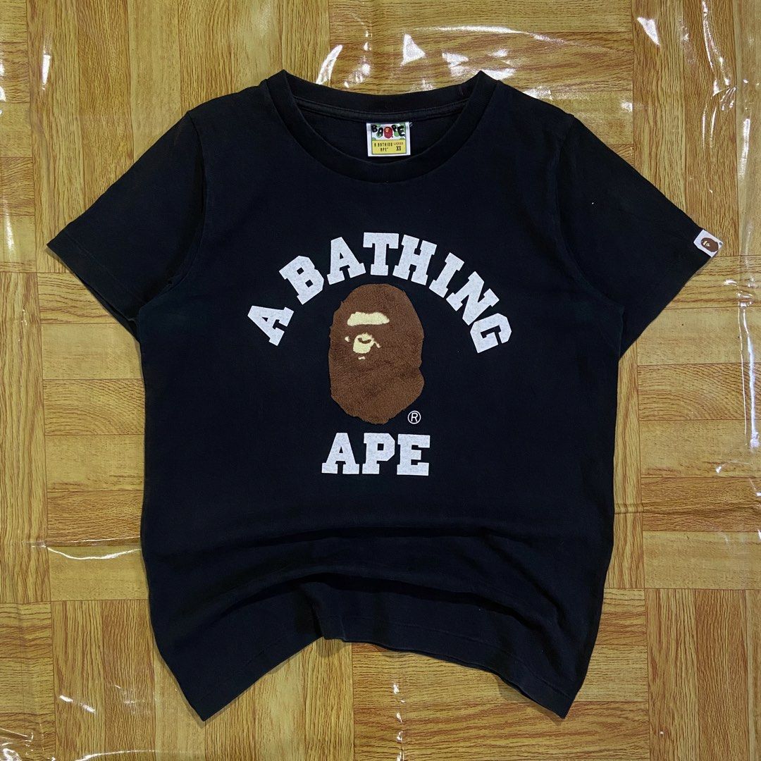 A Bathing Ape Carpet College Tee For Womens (Category: Shirts) located in Dasmarinas. Submitted by thrift2gems (Listing ID 1470705765, Image 1). Description: A Bathing Ape Carpet College Tee For Womens✨ -WIDTH: 17 -LENGTH: 23 -COLOR RATE: 9/10 -CONDITION: 9/10 -ISSUE: SLIGHTLY FADE 9/10 COLOR RATE.