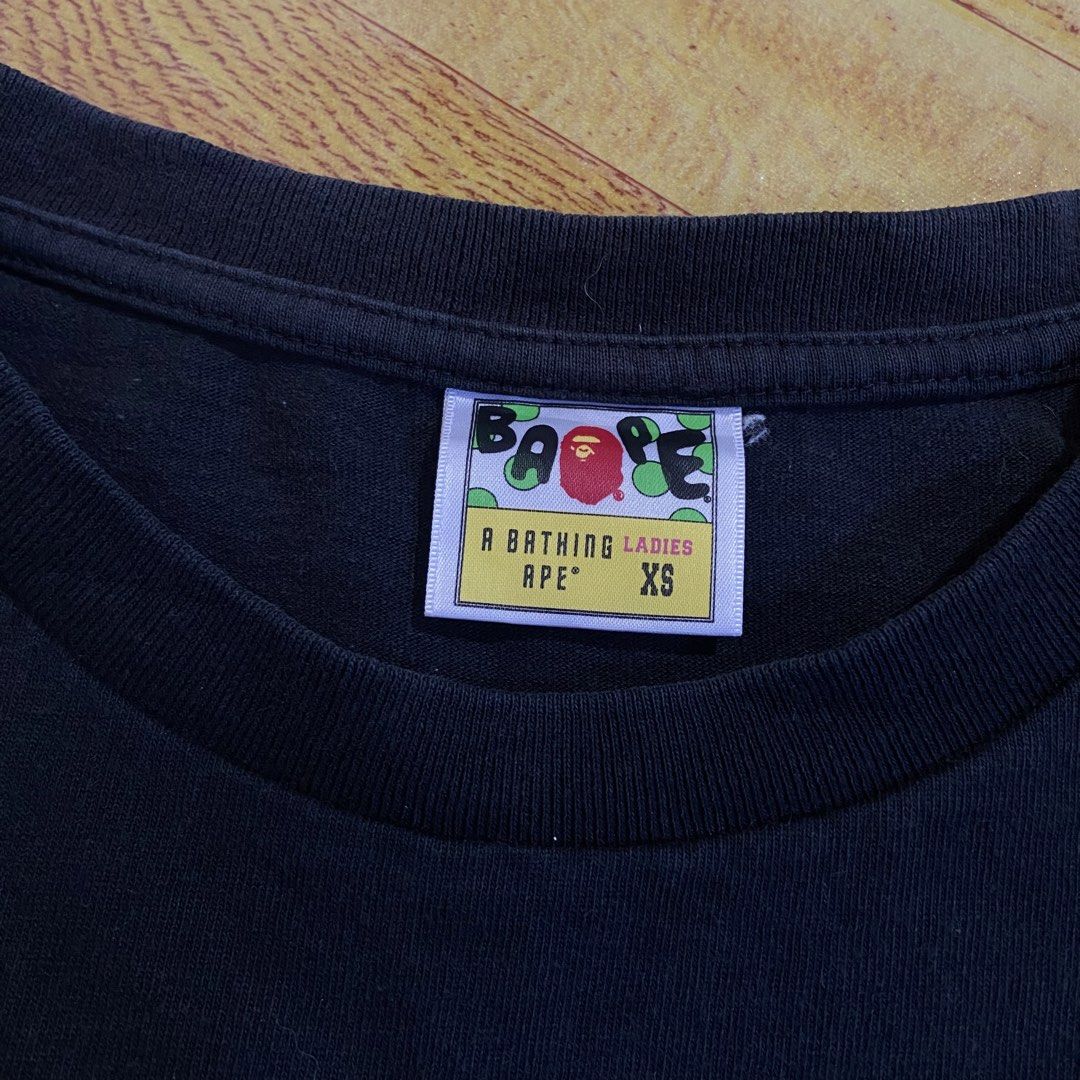 A Bathing Ape Carpet College Tee For Womens (Category: Shirts) located in Dasmarinas. Submitted by thrift2gems (Listing ID 1470705765, Image 3). Description: A Bathing Ape Carpet College Tee For Womens✨ -WIDTH: 17 -LENGTH: 23 -COLOR RATE: 9/10 -CONDITION: 9/10 -ISSUE: SLIGHTLY FADE 9/10 COLOR RATE.