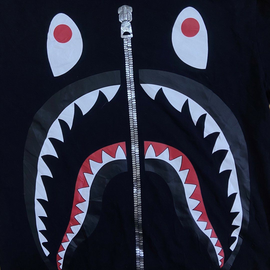 A Bathing Ape Shark Longsleeve (Category: Hoodies) located in Dasmarinas. Submitted by thrift2gems (Listing ID 1470706090, Image 3). Description: A Bathing Ape Shark Longsleeve✨ -WIDTH: 20 -LENGTH: 27.5 -COLOR RATE: 9.5/10 -CONDITION: 9.5/10 -ISSUE: NONE.