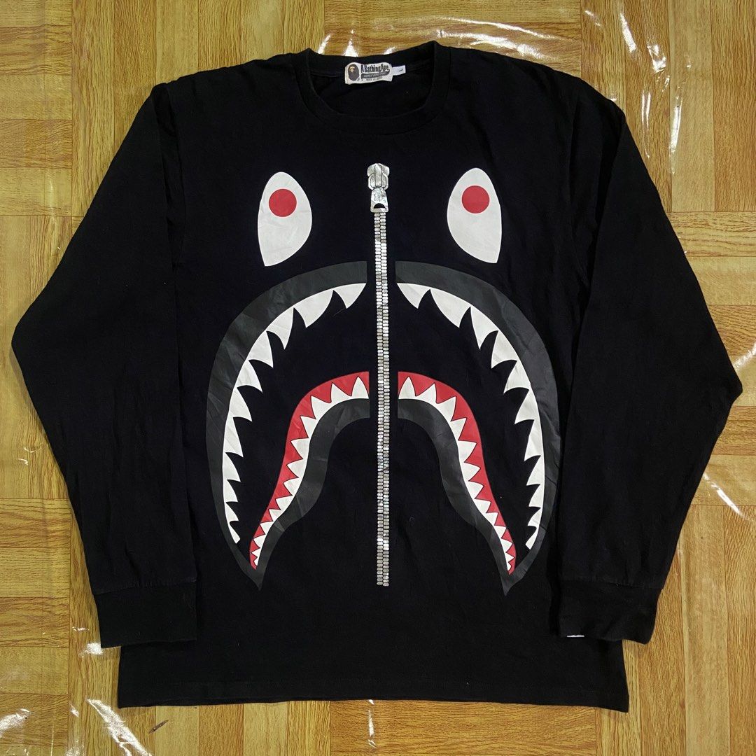 A Bathing Ape Shark Longsleeve (Category: Hoodies) located in Dasmarinas. Submitted by thrift2gems (Listing ID 1470706090, Image 1). Description: A Bathing Ape Shark Longsleeve✨ -WIDTH: 20 -LENGTH: 27.5 -COLOR RATE: 9.5/10 -CONDITION: 9.5/10 -ISSUE: NONE.
