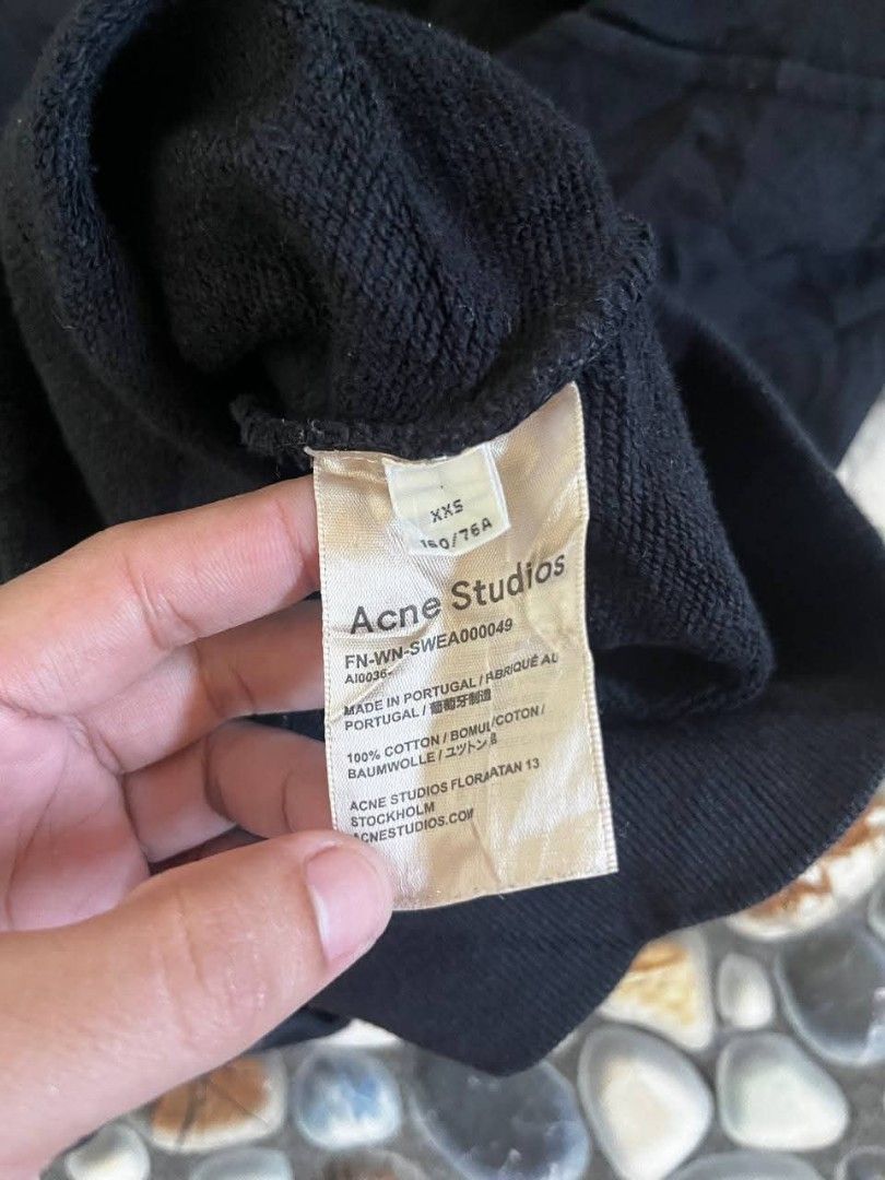 Acne Studios Black Sweatshirt Size XXS (Category: Longsleeves) located in Baler. Submitted by vansonearth (Listing ID 1470698148, Image 3). Description: - Brand: Acne Studios - Color: Black with white printed chest logo - Size: XXS (160/76A), classic relaxed fit - Material: 100% cotton, heavyweight fleece lining made in Portugal - Details: Ribbed cuffs and hem - Condition: Clean overall shape with no major flaws.