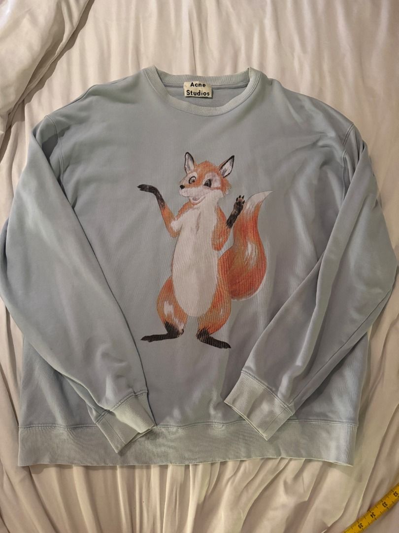 Acne Studios Fox Print Light Blue Sweatshirt L (Category: Longsleeves) located in Cebu City. Submitted by _t.rix (Listing ID 1470580065, Image 1). Description: - Brand: Acne Studios - Color: Light Blue - Size: Large - Design: Fun fox graphic on the front with branding text near the back collar - Details: Classic crew neck, ribbed cuffs and hem - Material: 100% Cotton - Origin: Made in Portugal.