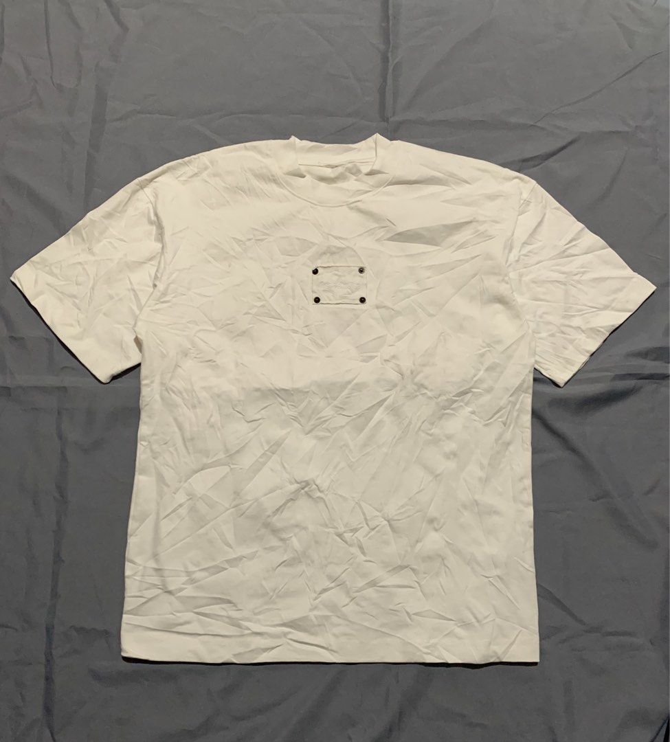 Acne Studios White T-Shirt with Embroidered Pocket Patch (Category: Luxury Apparel) located in General Santos City (Dadiangas). Submitted by stockyards (Listing ID 1470589703, Image 1). Description: - Brand: Acne Studios - Color: White - Fit: Oversized, relaxed drop shoulder - Material: Premium heavy cotton - Details: Chest pocket patch with embroidered logo and four metal rivets - Measurements: ~22" chest width, ~29.5" length.