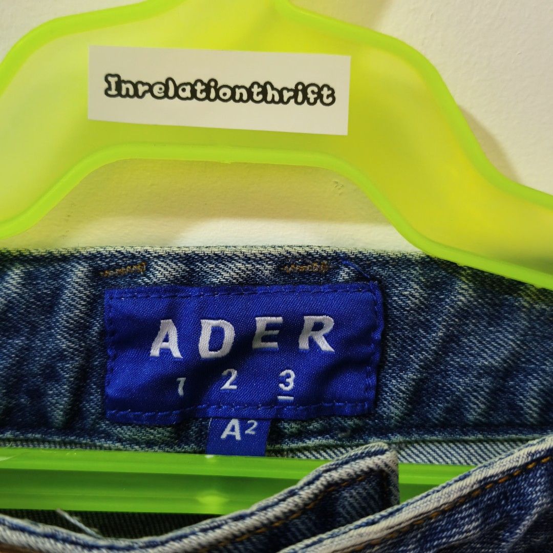 Ader Error 2020SS Denim Shorts Leather Card Holder Size A2 (Category: Shorts) located in Quezon City. Submitted by inrelationthrift (Listing ID 1470675024, Image 3). Description: - Brand: Ader Error (2020 Spring/Summer Collection) - Size: A2 (Waist: ~14 inches flat) - Material: 100% Cotton - Color: Blue - Details: Distressed frayed hems, unique patchwork pocket design, and front leather cardholder accent - Condition: Cleanly stored, excellent str